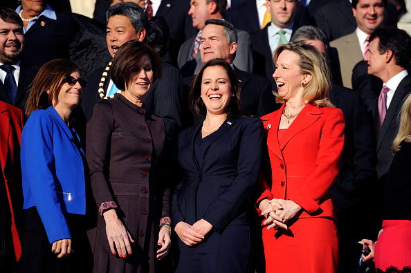 From left, Rep.-elects Martha McSally, R-Ariz., Mimi Walters, R-Calif., Elise Stefanik, R-N.Y., and Barbara Comstock, R-Va., gather on the House Steps of the Capitol for the 114th Congress's freshman class photo, November 18, 2014. (Photo By Tom Williams/CQ Roll Call)