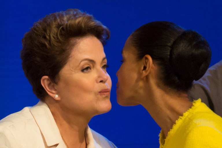 Brazil's President Dilma Rousseff, presidential candidate for re-election of the Workers Party (PT), left, and Marina Silva, presidential candidate of the Brazilian Socialist Party, PSB, greet each other as they arrive for a televised presidential debate in Rio de Janeiro, Brazil, Thursday, Oct. 2, 2014. Brazil will hold general elections on Oct. 5. (AP Photo/Felipe Dana)