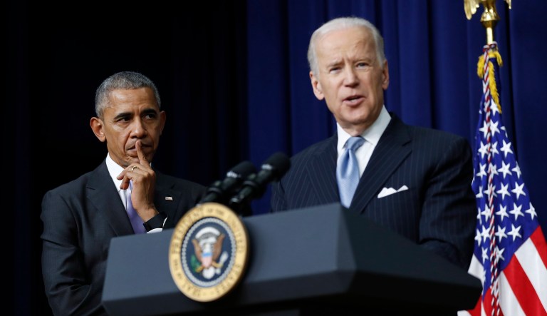 Former President Barack Obama listens as then-Vice President Joe Biden speaks in the South Court Auditorium in the Eisenhower Executive Office Building on the White House complex in Washington. (AP Photo/Carolyn Kaster)