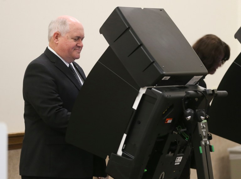 GOP congressional candidate in the 4th district Ron Estes votes at Holy Cross Lutheran Church, Tuesday, April 11, 2017, in Wichita, Kan. The special election Tuesday between Democrat James Thompson and Estes to fill the seat vacated by CIA Director Mike Pompeo is being watched across the nation for signs of a backlash against Republicans or waning support from Trump's supporters. (Jaime Green/The Wichita Eagle via AP)
