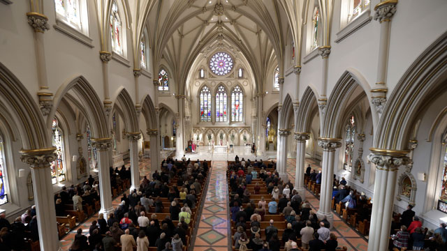 Bishop Richard Malone, bishop of Buffalo, speaks to Catholics after distributing ashes on Ash Wednesday during Mass at St. Joseph Cathedral in Buffalo, N.Y., Wednesday, Feb. 13, 2013.