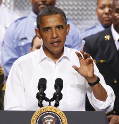 Steve Helber/AP
President Obama speaks at a Chesterfield County fire station in Richmond, Va., during the last stop on his bus tour Wednesday.