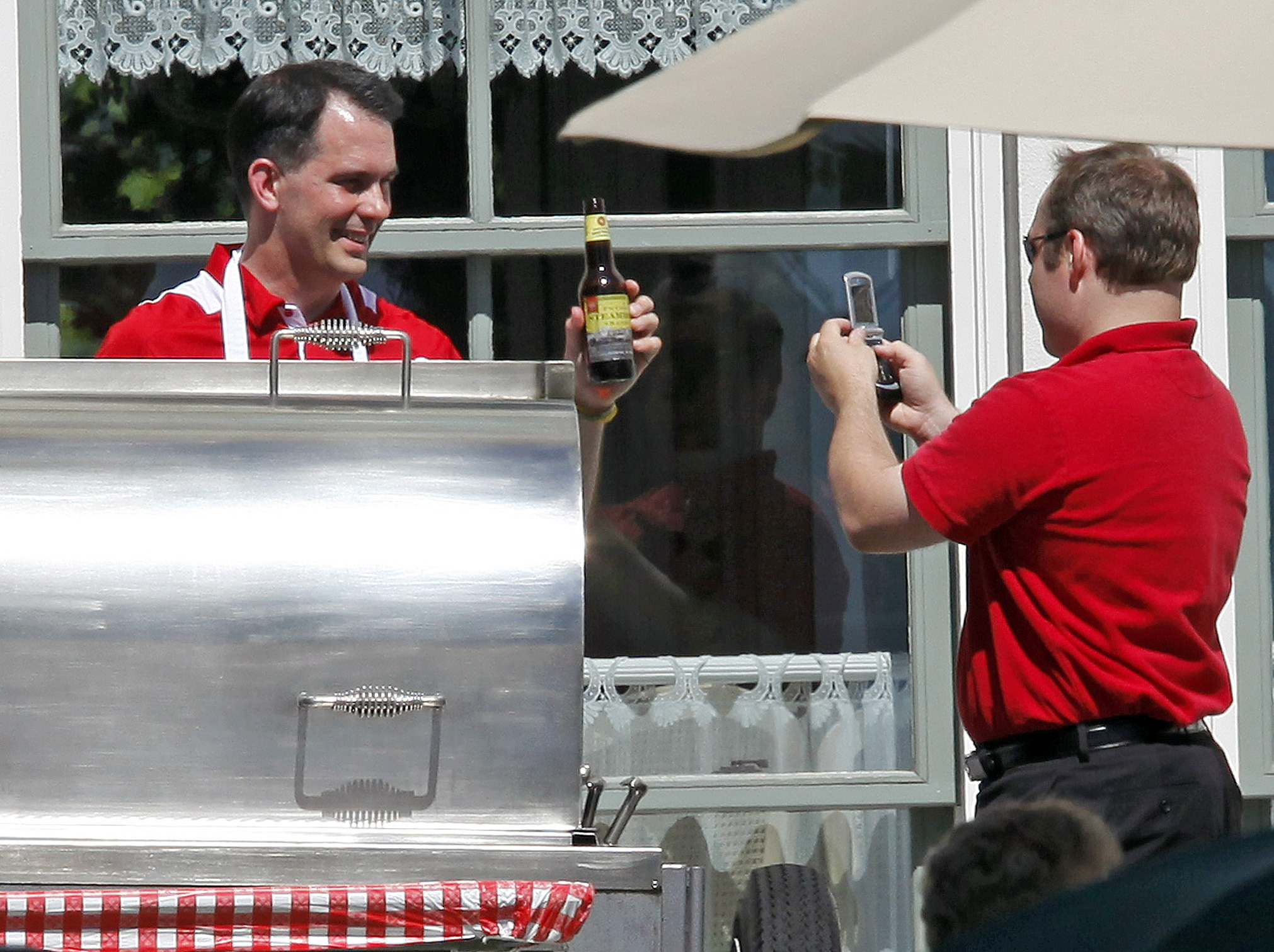 Walker grills for lawmakers as helicopter circles
