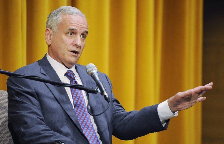 Minnesota Gov. Mark Dayton said 's wrong that Minnesota has a lower minimum wage than all of its Midwest neighbors and one of the lowest in the country. (Hannah Foslien/Getty Images)