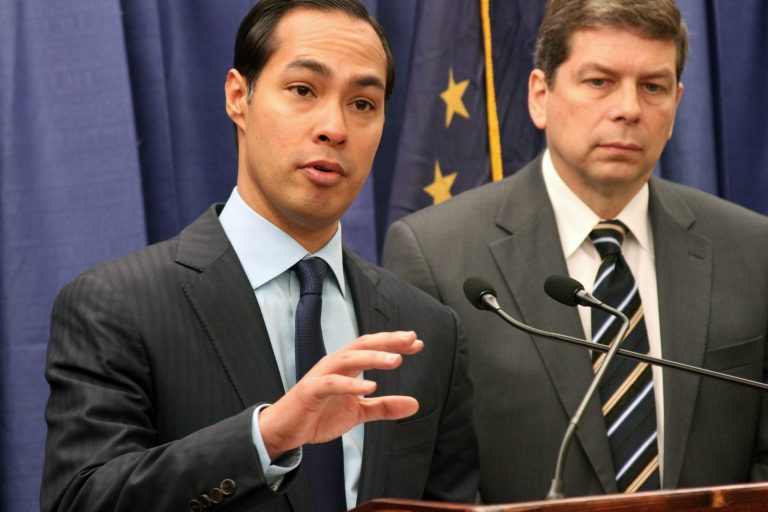 U.S. Housing and Urban Development Secretary Julian Castro, left, announces that nearly $60 million in grants have been awarded to tribal communities across the nation during a news conference Monday, Oct. 6, 2014, in Anchorage, Alaska. U.S. Sen. Mark Begich, D-Alaska, listens at right. (AP Photo/Mark Thiessen)