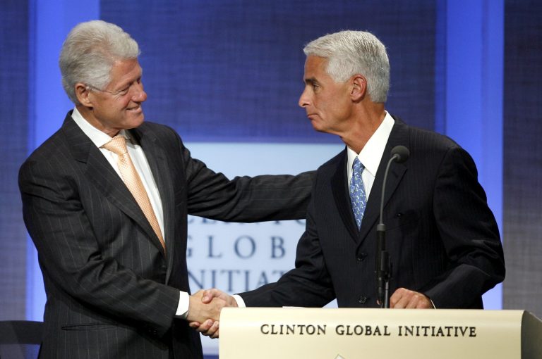 Former President Bill Clinton, left, shakes hands with then-Florida Gov. Charlie Crist, before a panel discussion at the Clinton Global Initiative Annual Meeting Wednesday, Sept. 26, 2007 in New York. (AP Photo/Jason DeCrow)