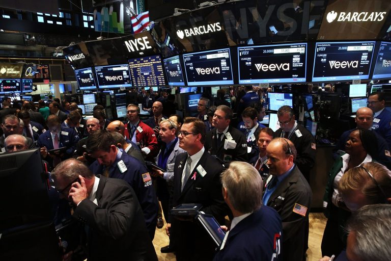 Traders work on the floor of the New York Stock Exchange on Wednesday. (Spencer Platt/Getty Images)