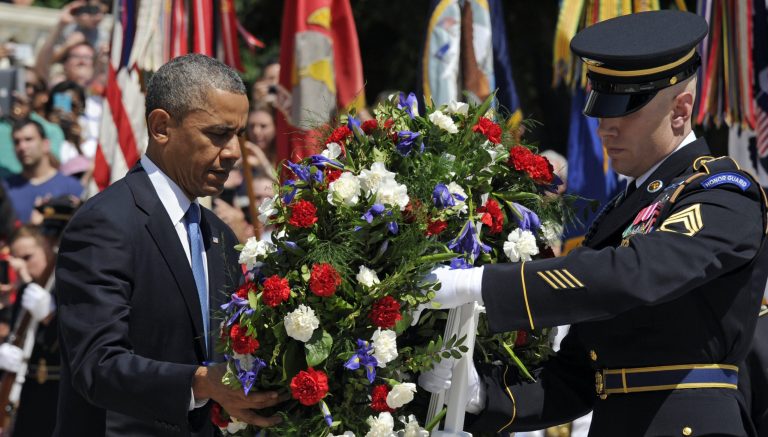 President Barack Obama lays a wreath at the Tomb of the Unknowns at Arlington National Cemetery in Arlington, Va., on Memorial Day, Monday, May 26, 2014. (AP Photo/Susan Walsh)