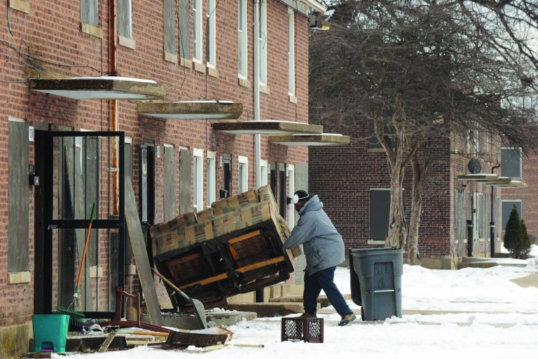 A man moves furniture at the Altgeld Gardens housing project Thursday, Feb. 14, 2008, on Chicago's South Side.  where Democratic presidential hopeful, Sen. Barack Obama, D-Ill., used to work as a community organizer. (AP Photo)