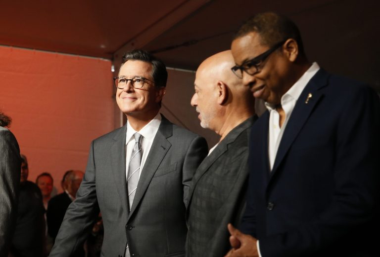IMAGE DISTRIBUTED FOR THE TELEVISION ACADEMY - From left to right, host Stephen Colbert, executive vice president, specials, music and live events, CBS Entertainment Jack Sussman and Television Academy chairman and CEO Hayma Washington smile after rolling out red carpet during the 69th Primetime Emmy Red Carpet Rollout at the Microsoft Theater on Tuesday, Sept. 12, 2017 in Los Angeles. (Photo by Danny Moloshok/Invision for the Television Academy/AP Images)