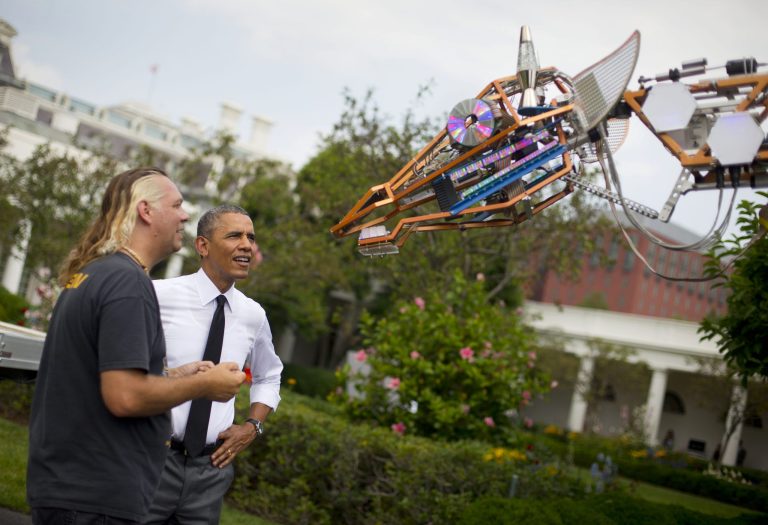 President Barack Obama meets Lindsay Lawlor of San Diego, Calif., and his creation, a 17-foot-tall, 2,200-lb robotic giraffe that 
