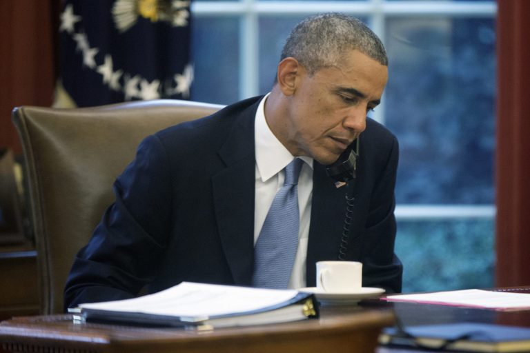 President Obama speaks on the phone to Saudi Arabia's King Abdullah from his desk at the White House Wednesday, ahead of his address to the nation tonight regarding Iraq and ISIS group militants. (AP Photo/Charles Dharapak)