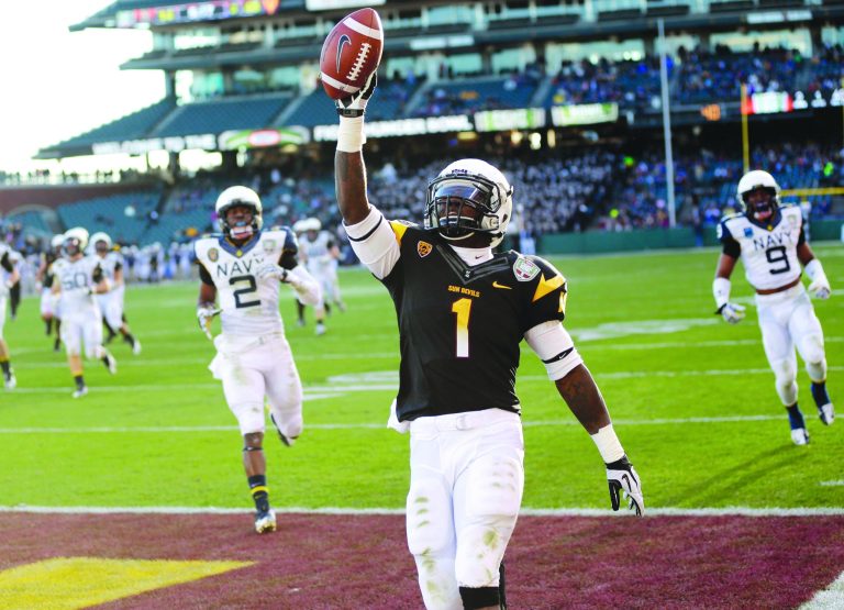 Marcio Jose Sanchez/AP
Marion Grice and Arizona State scored touchdowns on their first nine possessions as they blew out Navy in the Fight Hunger Bowl.
