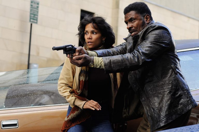 This film image released by Warner Bros. Pictures shows Halle Berry, left, and David Keith in a scene from 