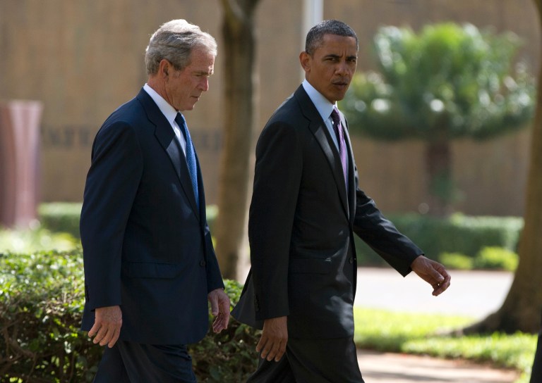 President Obama walks with former President George W. Bush during a ceremony in Dar es Salaam, Tanzania, on July 2. (AP Photo/Evan Vucci)