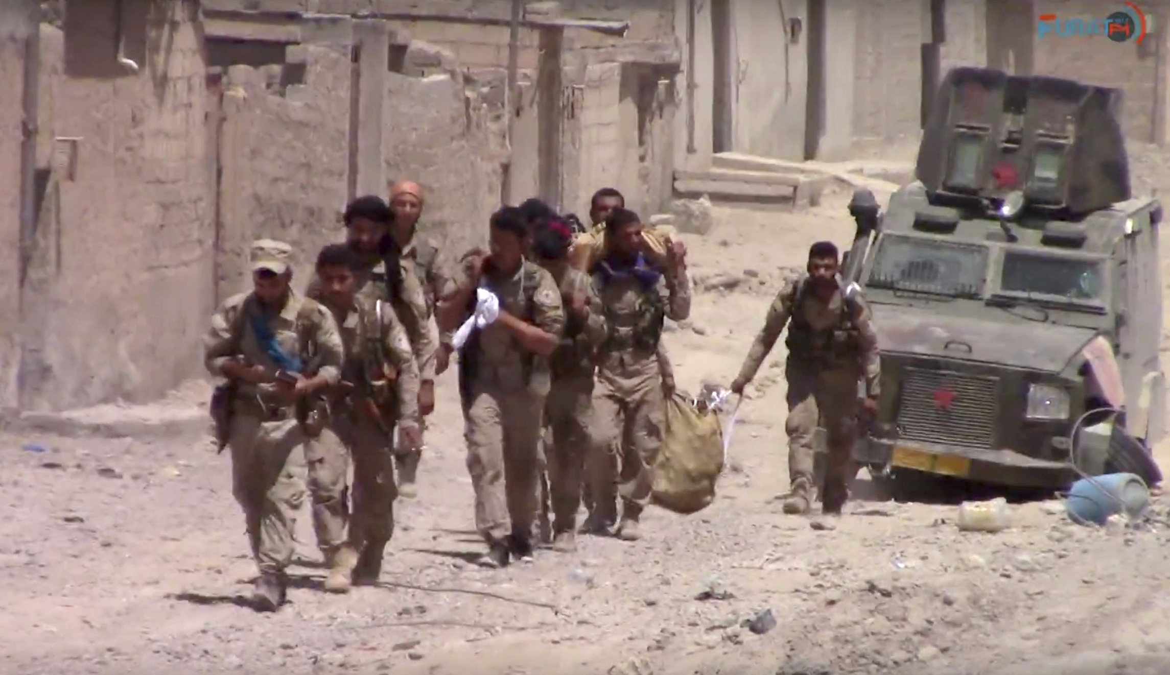 US-backed Syrian fighters enter the capital of ISIS’ caliphate