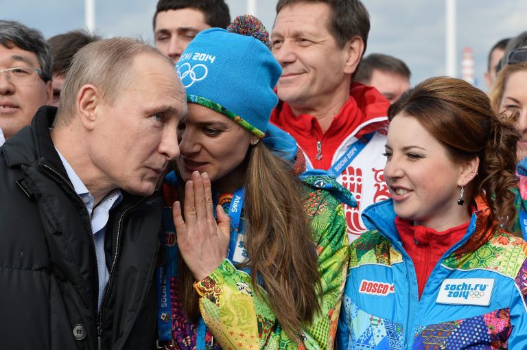 Russian President Vladimir Putin speaks with Olympic Village Mayor Elena Isinbaeva while visiting the Coastal Cluster Athletes Olympic Village ahead of the Sochi 2014 Winter Olympics on Wednesday, Feb. 5, 2014 in Sochi, Russia.  (AP Photo/Pascal Le Segretain, Pool)