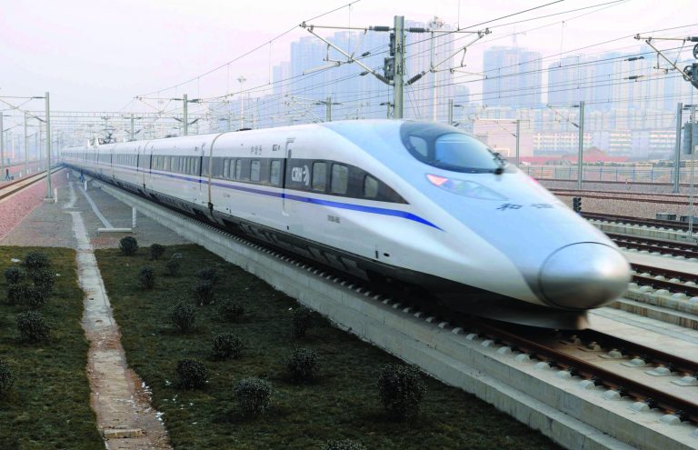 In this photo released by China's Xinhua news agency, a high-speed train G802 leaves for Beijing from Shijiazhuang, capital of north China's Hebei Province, Wednesday, Dec. 26, 2012. China has opened the world's longest high-speed rail line, which runs 2,298 kilometers (1,428 miles) from the country's capital in the north to Guangzhou, an economic hub in the Pearl River delta in southern China. (AP Photo/Xinhua, Wang Xiao) NO SALES
