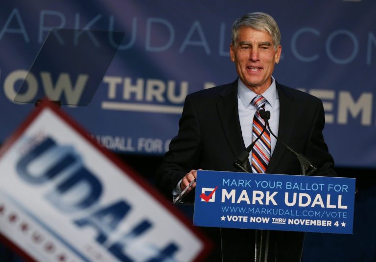 Sen. Mark Udall, D-Colo., prepares to introduce first lady Michelle Obama during rally for Udall's re-election bid in Denver on Thursday. (AP/David Zalubowski)