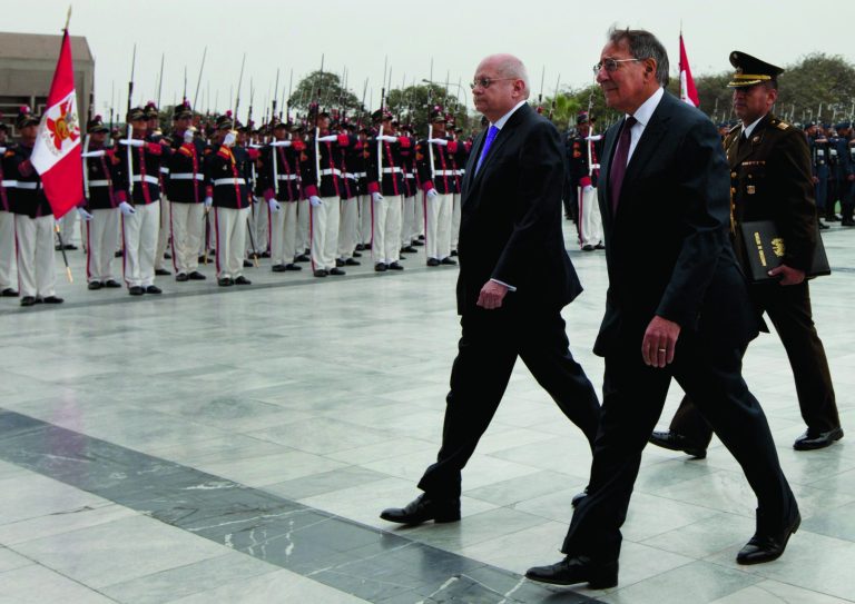 U.S. Defense Secretary Leon Panetta, right, walks with Peru's Defense Minister Pedro Cateriano past the honor guard during a ceremony at army headquarters in Lima, Peru, Saturday, Oct. 6, 2012. Panetta is in Lima on an official visit for one day. (AP Photo/Martin Mejia)