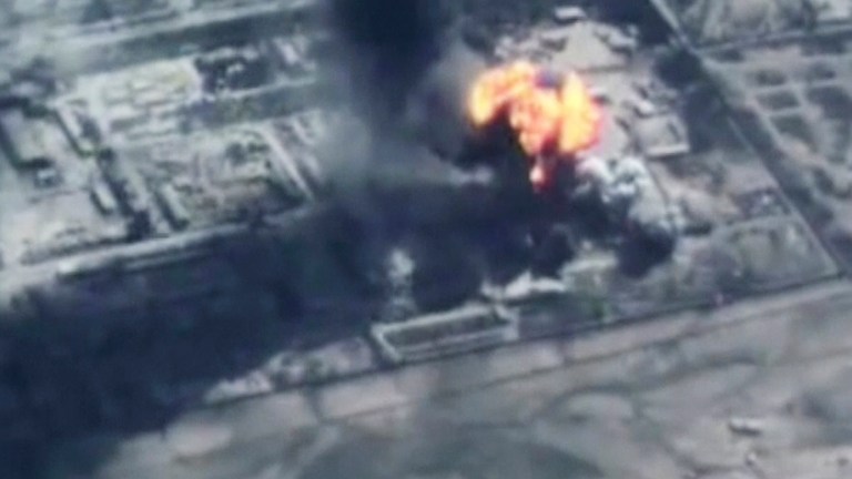 In this image made from undated video provided by Jordanian military via Jordan TV, explosions go off as the military carried out airstrikes at an undisclosed location in Syria. The military carried out airstrikes on Islamic State weapons depots and training sites on Thursday and Friday. King Abdullah II has thrust Jordan to the center of the war against the Islamic State group with his pledge of relentless retaliation for the killing of one of his pilots. (AP Photo/Jordanian military via Jordan TV)