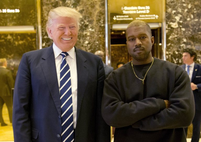 Donald Trump and Kanye West pose for a picture in the lobby of Trump Tower in New York during the transition. A new bettor's line gives the president the highest odds to win reelection and West the lowest chances of beating Trump. (AP Photo/Seth Wenig)