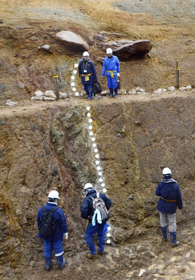   In this Dec. 14, 2012 photo, members of a Japanese scientist team check a fault, marked with white dots, underneath the Higashidori nuclear plant in Higashidori in Aomori prefecture, northern Japan. The four-member panel commissioned by the Nuclear Regulation Authority said Thursday, Dec. 20, 2012 that at least two major faults underneath the nuclear plant are believed to be active - a contradiction of operator Tohoku Electric Power Coâs assertion that they are inactive. The panel said the faults could cause magnitude 7-class earthquakes near the reactor, which was opened in 2005 and is among the newest of Japanâs aging reactors. (AP Photo/Kyodo News) JAPAN OUT, MANDATORY CREDIT, NO LICENSING IN CHINA, HONG KONG, JAPAN, SOUTH KOREA AND FRANCE  