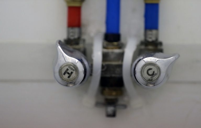 The handles of a shower are seen during a tour of a U.S. Customs and Border Protection temporary holding facility near the Donna-Rio Bravo International Bridge, Wednesday, Dec. 7, 2016, in Donna, Texas. The tent facility, primarily to be used as a temporary holding site for children and families who have entered the county illegally, is due to process up to 500 people a day. (AP Photo/Eric Gay)