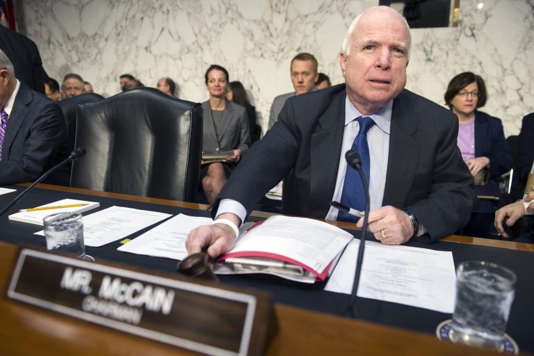 Senate Armed Services Committee Chairman Sen. John McCain, R-Ariz., bangs the gavel to start the committee's hearing to examine global challenges and US national security strategy, Wednesday on Capitol Hill in Washington. (AP Photo/Cliff Owen)