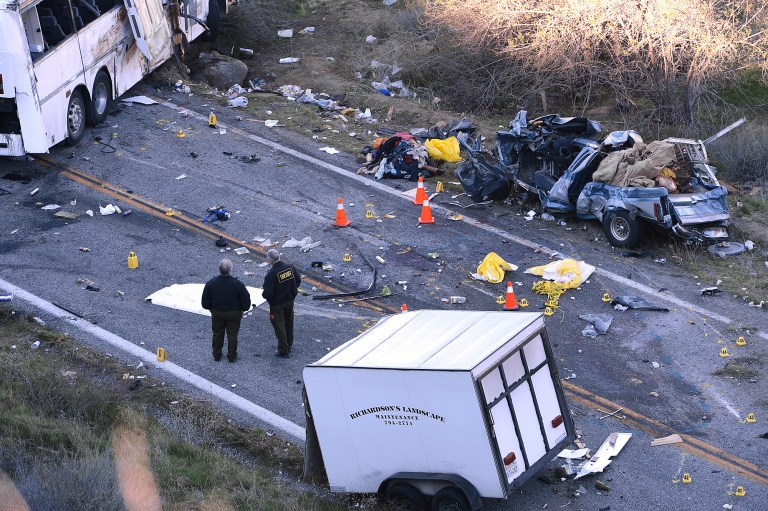 FILE - In this Feb. 4, 2013 photo, investigators work the scene where a tour bus collided with a pickup truck on Highway 38 north of Yucaipa, Calif., killing eight people. Federal regulators ordered the tour bus operator, National City, Calif.-based Scapadas Magicas LLC,  to immediately stop operating because its buses weren't properly maintained or inspected and its drivers weren't properly vetted for qualifications. Intercity bus and truck companies with a continuing history of safety problems will be easier to shut down under new regulations the Federal Motor Carrier Administration said Friday that it plans to issue. The regulations give the agency authority to put out of business operators who have been cited for repeated problems, even if their most recent inspection alone doesn't quite meet the threshold for closure, the agency said. (AP Photo/The Sun, Rick Sforza, File)