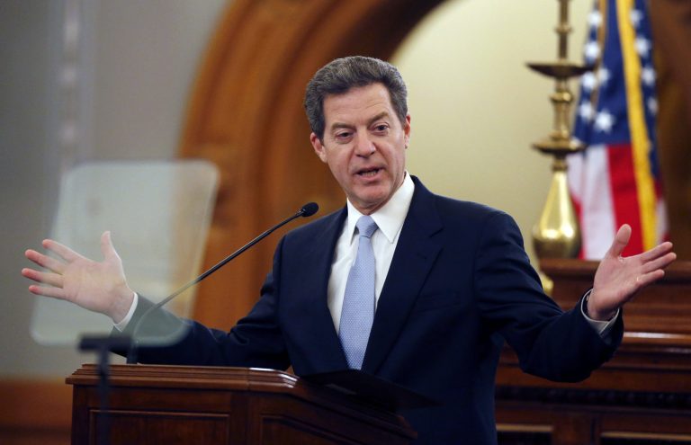 Kansas Gov. Sam Brownback delivers his State of the State speech to an annual joint session of the House and Senate at the Statehouse in Topeka, Kan., Wednesday, Jan. 15, 2014. (AP Photo/Orlin Wagner)