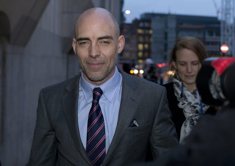 Former tabloid journalist Dan Evans leaves The Old Bailey law court in London, Monday, Jan. 27, 2014. Evans told Britain's phone hacking trial on Monday that he intercepted voicemails with the knowledge of senior staff _ not just at the now-defunct News of the World, whose employees are standing trial, but at the rival Sunday Mirror. Dan Evans has pleaded guilty to phone hacking while working at both newspapers between 2003 and 2010. He gave evidence as a prosecution witness at the trial of former News of the World editors Rebekah Brooks and Andy Coulson and five others. (AP Photo/Alastair Grant)