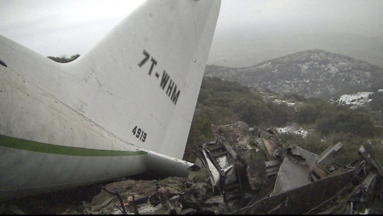 The wreckage of an Algerian military transport plane which slammed into a mountain Tuesday in the country's rugged eastern region, is pictured Wednesday, Feb. 12, 2014. The crash killed scores of people and left just one survivor, the defense ministry said. The plane was discovered in pieces on Mount Fortas near the town of Ain Kercha, 50 kilometers (30 miles) southeast of Constantine, the main city in eastern Algeria. (AP Photo/Anis Belghoul)