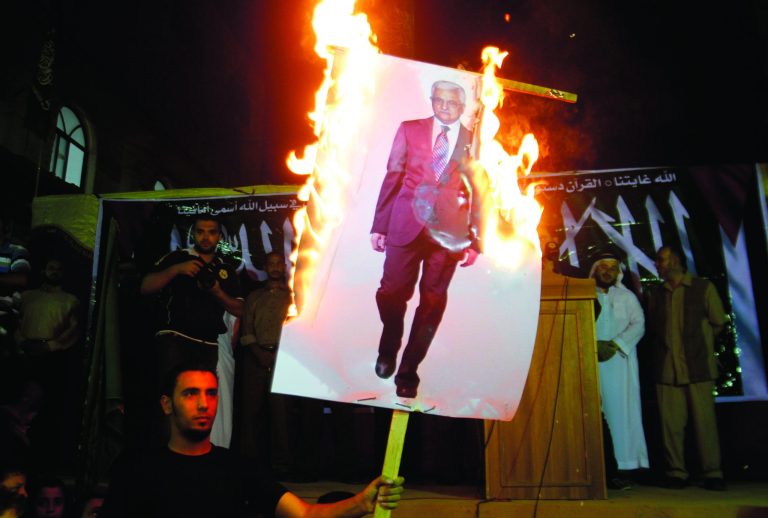 Palestinians march during a protest against president Mahmoud Abbas in the Jabaliya Refugee Camp, northern Gaza Strip Saturday, Nov. 3, 2012. Gazans protested against Abbas' remarks at an Israeli television that suggested millions of Palestinian refugees and their descendants would not be able to return to the places they fled, or were forced to flee, during the fighting surrounding Israel's creation in 1948. (AP Photo/Hatem Moussa)