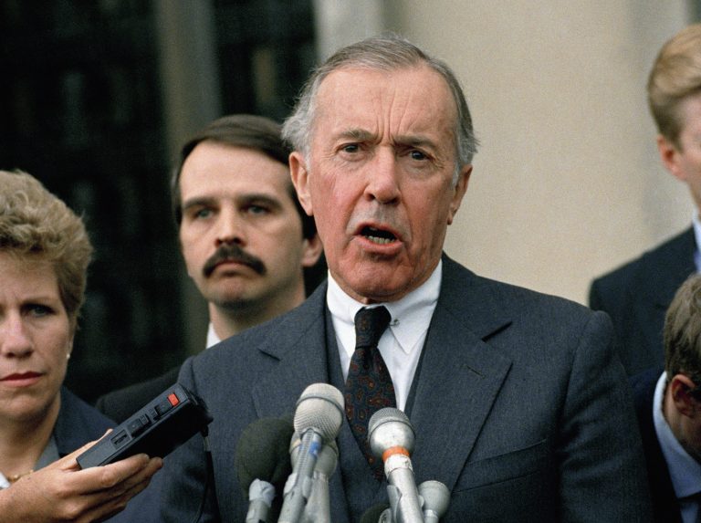 FILE - This May 11, 1989 file photo shows Iran-Contra special prosecutor Lawrence Walsh speaking to reporters outside U.S. District in Washington. Walsh, the Iran-Contra prosecutor who investigated Reagan officials, has died. (AP Photo/Rick Bowmer, File)