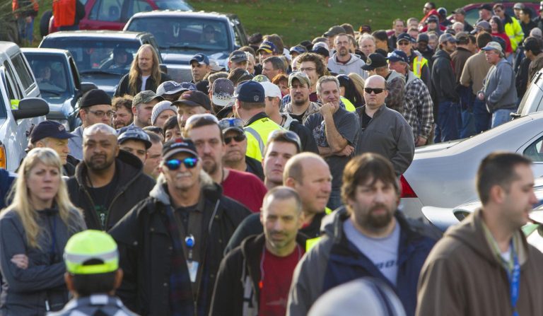 Machinists line up to vote on Boeing's  contract at the Aerospace Machinists Union headquarters in Everett, Wash., on Wednesday, Nov. 13, 2013.  Thousands of Boeing machinists in the Northwest cast their ballots Wednesday on a contentious contract proposal that would have workers exchange concessions for decades of secure jobs.  (AP Photo/The Seattle Times, Mike Siegel) 