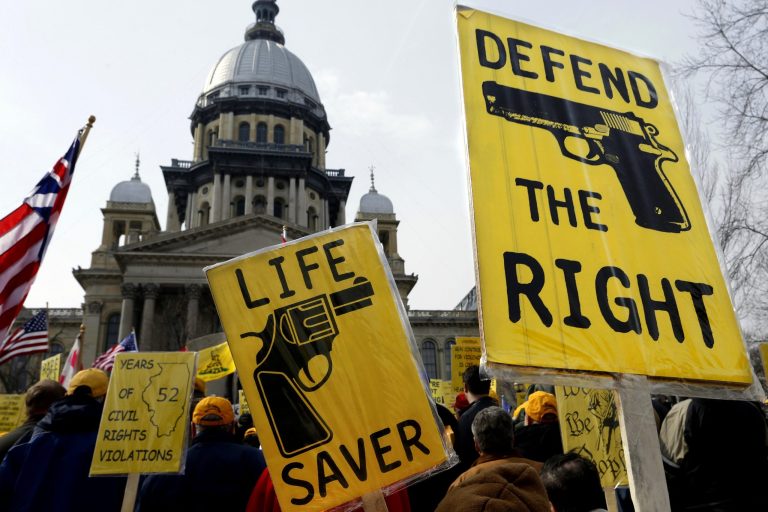 Gun rights lobbyists and gun owners rally in support of concealed carry gun legislation in front of the Illinois State Capitol on March 5, 2014, in Springfield, Illinois. 