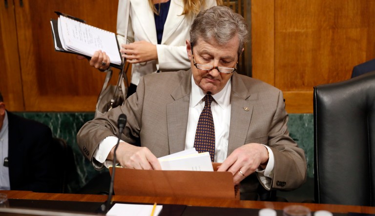 Sen. John Kennedy, R-La., readies his papers before a Senate Judiciary Committee hearing. (AP Photo/Alex Brandon)