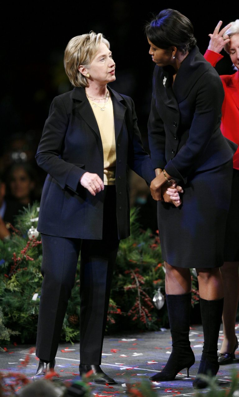 Presidential hopeful, Sen. Hillary Rodham Clinton, D-N.Y., talks with Michelle Obama at the end of the Iowa Democratic Party's Jefferson Jackson Dinner, Saturday, Nov. 10, 2007, in Des Moines, Iowa. (AP Photo/Charlie Neibergall)