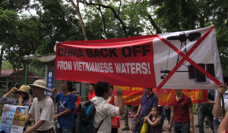 Vietnamese protest outside the Chinese Embassy on Sunday, May 11, 2014 in Hanoi, Vietnam, against Beijing's deployment of an oil rig in the contested waters of the South China Sea. (AP Photo/Chris Brummitt)
