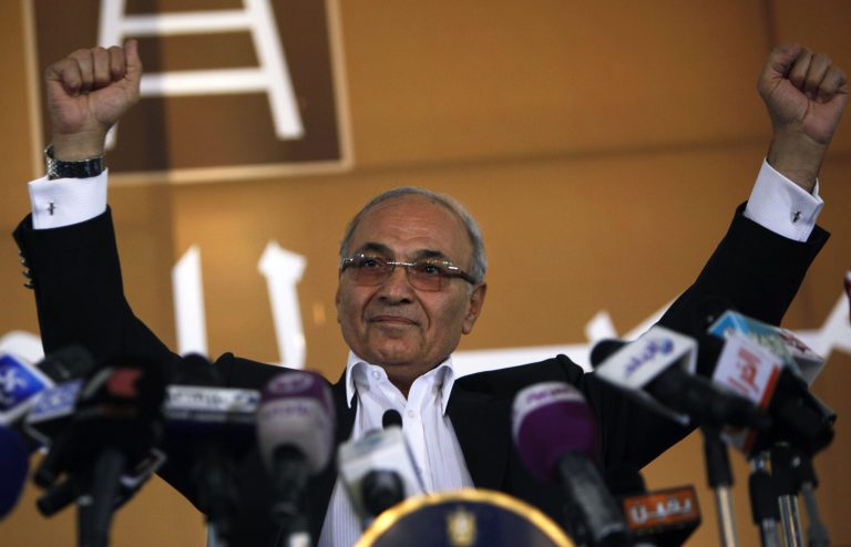   Egyptian presidential candidate Ahmed Shafiq addresses his supporters during an election rally in Cairo, Egypt, Thursday, June 14, 2012. Judges appointed by Hosni Mubarak dissolved the Islamist-dominated parliament on Thursday and ruled that Mubarak's former prime minister can stand in the presidential runoff this weekend _ derailing Egypt's transition to democracy and setting the stage for the military and remnants of the old regime to stay in power. (AP Photo/Nasser Nasser)  