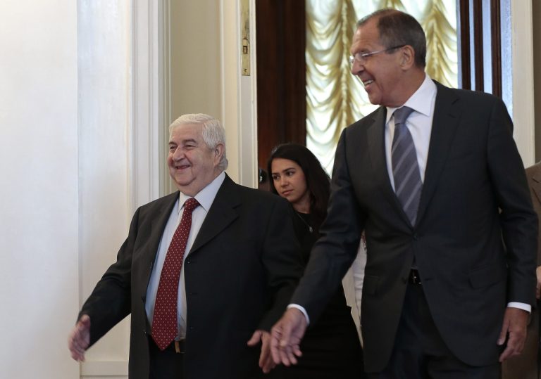 Russian Foreign Minister Sergey Lavrov welcomes his Syrian counterpart Walid al-Moallem, left, prior to talks in Moscow on Monday. (AP/Ivan Sekretarev)