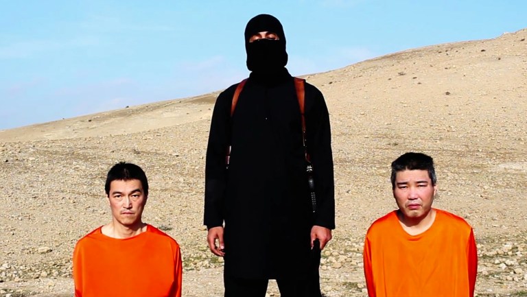 This image taken from an online video released by the Islamic State group's al-Furqan media arm on Tuesday, Jan. 20, 2015, purports to show the group threatening to kill two Japanese hostages that the militants identify as Kenji&nbsp;Goto Jogo, left, and Haruna Yukawa, right, unless a $200 million ransom is paid within 72 hours. Japan's Foreign Ministry's anti-terrorism section has seen the video and analysts are assessing it, a ministry official said on Tuesday. (AP Photo)