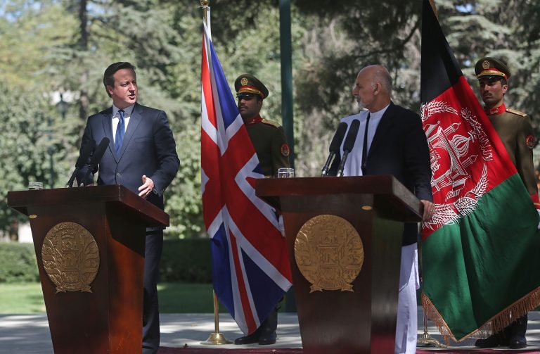 Afghanistan's president Ashraf Ghani Ahmadzai, second right, listens as Britain's Prime Minister David Cameron talks during a news conference at the presidential palace in Kabul, Afghanistan, Friday, Oct. 3, 2014. Britain's Prime Minister David Cameron on Friday pledged support for Afghanistan's newly sworn-in president and the country's new unity government, saying during a surprise visit to Kabul that Britain is committed to helping Afghans build a more secure and prosperous future. (AP Photo/Massoud Hossaini)