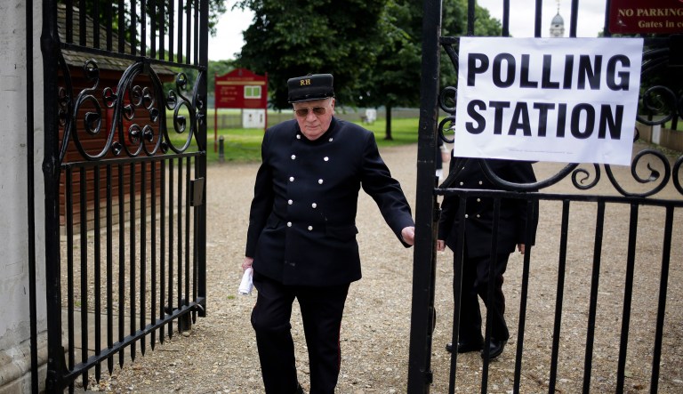 David Lyall, a Chelsea pensioner, leaves a polling station after voting in Britain's general election in London, Thursday, June 8, 2017. (AP Photo/Markus Schreiber)