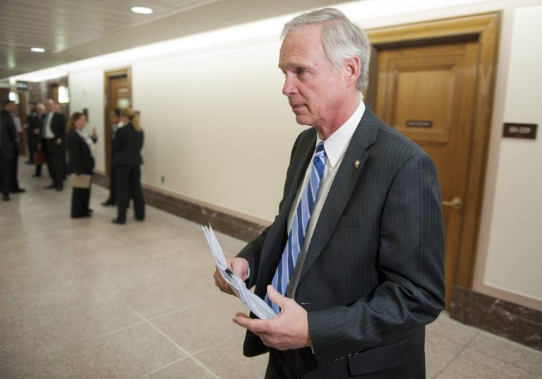 Sen. Ron Johnson, R-Wis., enters a hearing room to question then-Secret Service director Julia Pierson before a closed meeting of the Senate Homeland Security Committee in Washington last year. (AP Photo/Cliff Owen)