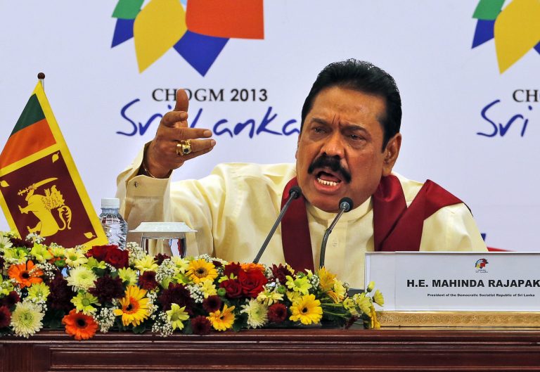 FILE - In this Nov. 17, 2013 file photo, Sri Lankan President Mahinda Rajapaksa speaks during a media briefing on the final day of the Commonwealth Heads of Governments Meeting (CHOGM) in Colombo, Sri Lanka. Rajapaksa says he will not allow a U.N. panel investigating allegations of war crimes to visit Sri Lanka. Rajapaksa told foreign journalists on Tuesday, Aug. 19, 2014 that he does not accept any investigation by the United Nations into allegations of abuses by his soldiers and the defeated Tamil Tiger rebels at the end of the country's civil war in 2009. (AP Photo/Eranga Jayawardena, File)