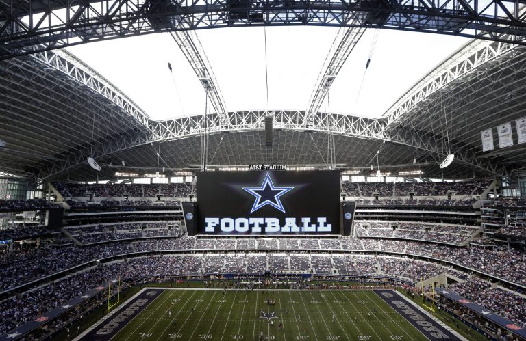 FILe - In this Nov. 3, 2013, file photo, the roof is open on the stadium before an NFL football game between the Dallas Cowboys and the Minnesota Vikings in Arlington, Texas. Forbes says Cowboys are the first U.S. sports franchise to top $3 billion in value. For the eighth straight year, the Cowboys are worth the most of all 32 NFL franchises, valued at $3.2 billion. (AP Photo/Sharon Ellman, File)