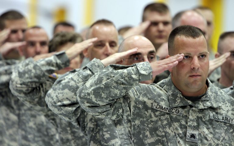 Soldiers salute during a deployment ceremony in South Burlington, Vt., Friday, Sept. 10, 2010. (AP Photo/Toby Talbot)