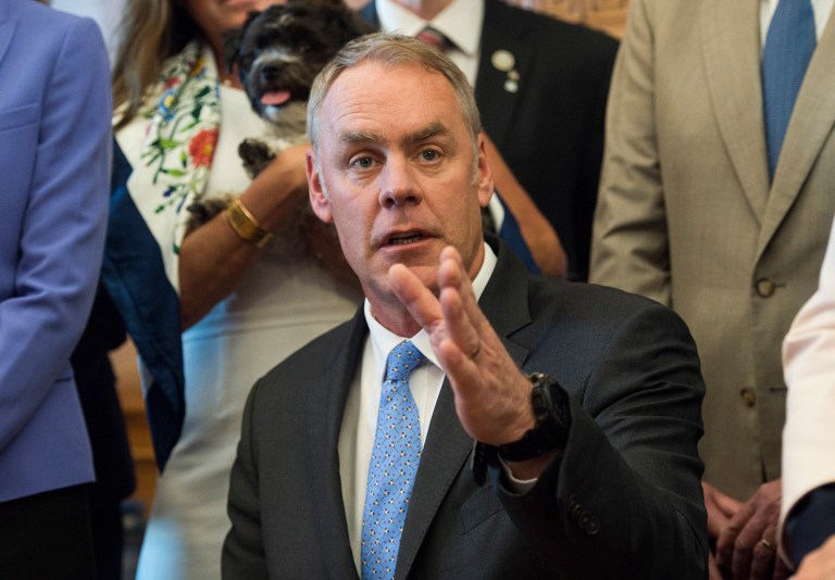Interior Secretary Ryan Zinke signed an order lifting a moratorium on new coal leases on federal lands and a related order on coal royalties. (AP Photo/Molly Riley)